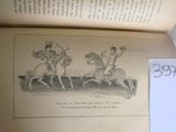 un livre ouvert sur lequel est dessiné un homme à cheval et un homme à cheval