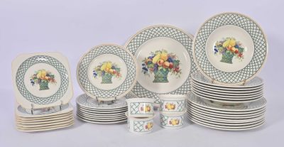 a lot of plates and cups that are sitting on a table