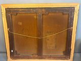 an old wooden frame with a rope hanging from it ' s sides