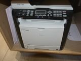 a printer that is sitting on top of a cabinet