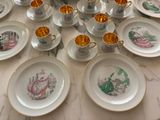 a lot of plates and cups on the table