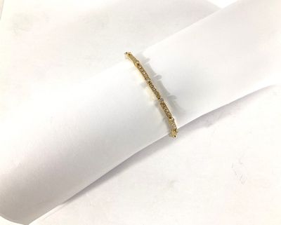 yellow gold plated ring with a thin band on a white napkin