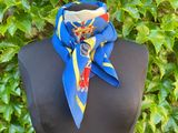 a close up of a mannequin torso with a blue and yellow scarf