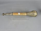 pair of antique brass and horn horn handles on acrylic display stand