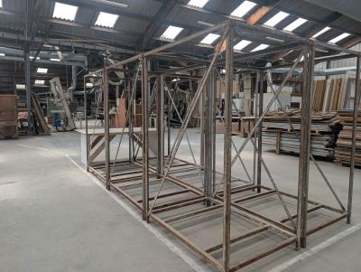 a large metal structure in the middle of a warehouse
