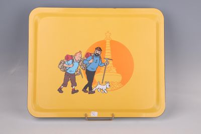 a yellow tray with a picture of two people and a dog on it