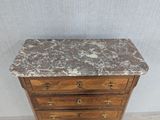 an image of a marble top chest of drawers in a room