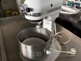 a mixer that is sitting on a table in a kitchen