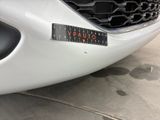 a close up of a car with a sticker on the front of it