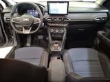 the interior of a car with a steering wheel, dashboard, and a touch screen