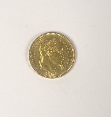 a gold coin with a picture of a woman on it