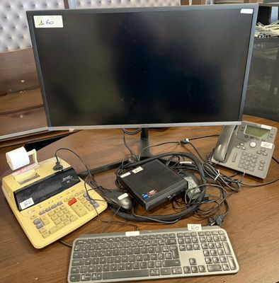 an image of a computer desk with a keyboard and a monitor