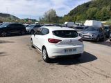 a white car parked in a parking lot next to other cars