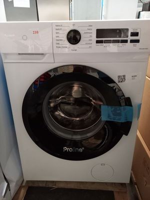 a washing machine that is in the corner of a room