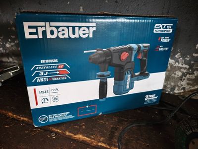 the box of a cordless drill is sitting on the table