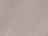 close up of a piece of white fabric with a small hole in the middle