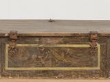 an old wooden box sitting on top of a cardboard box