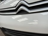 a close up of the front of a white car