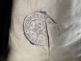 a close up of a person ' s pants with a badge on it