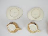 several different types of hats and cups on a white surface