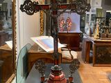 a cross that is on a table in a room