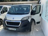 a white van that is parked next to a white van