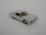 a toy car that is sitting on a white surface