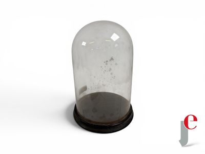a glass bellow with a wooden base and a black base