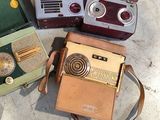 many different types of old fashioned radio on the ground