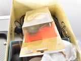 a yellow box filled with assorted items sitting on a table