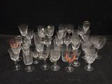 a lot of wine glasses sitting on a table