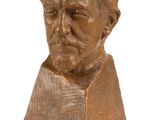 bronze bust of a man with a beard on a white background