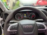 a steering wheel and dashboard of a car in a car showroom