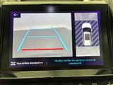 a picture of a car ' s rear view mirror with a car on it
