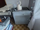 an image of a kitchen with a stove and cabinets