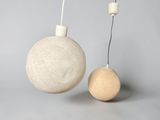 two balls that are sitting next to each other on a table