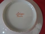 a white plate with a red writing on it
