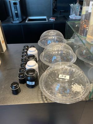 a counter with a variety of containers and containers on it