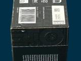 a black box with a label on it sitting on a blue surface
