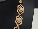 a close up of a necklace on a mannequin mannequin