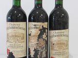 three bottles of wine sitting next to each other on a table