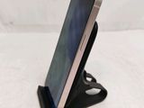 a cell phone that is sitting on a stand