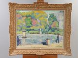 a painting on a easel with a painting of people in a park