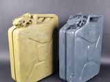 two yellow and gray jerry cans sitting side by side on a gray background