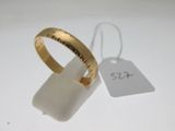a close up of a gold ring with a price tag on it