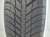 a close up of a tire on a white surface