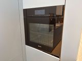 an oven built into the wall in the kitchen