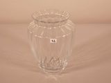 a glass vase that is sitting on a table