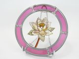 a picture of a pink stained glass plate with a flower on it