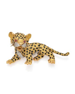 a gold and diamond leopard broochle